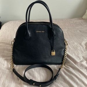 Michael Kors black tote bag w/ gold detailing. Adjustable straps.